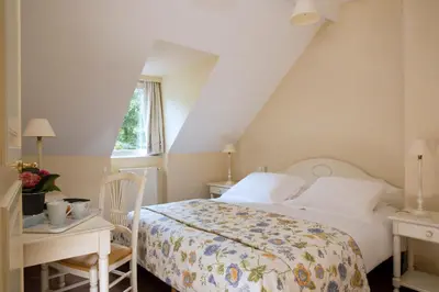 Un ou plusieurs lits dans un hébergement de l'établissement Cottages De La Bretesche