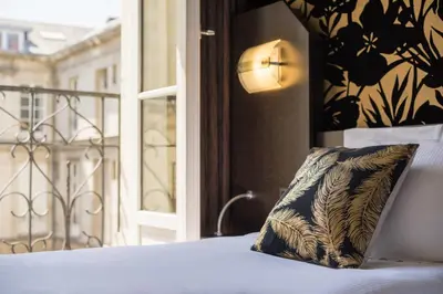Un ou plusieurs lits dans un hébergement de l'établissement Hôtel Voltaire Opéra