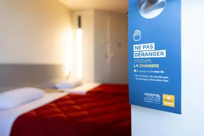 Un ou plusieurs lits dans un hébergement de l'établissement Premiere Classe Angers Beaucouzé