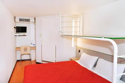 Un ou plusieurs lits dans un hébergement de l'établissement Premiere Classe Saint Nazaire - Trignac