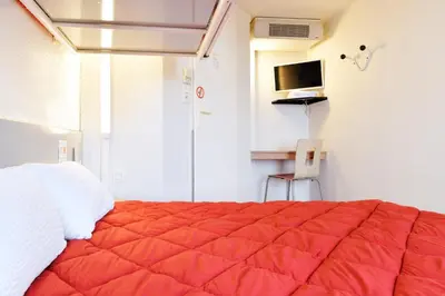 Un ou plusieurs lits dans un hébergement de l'établissement Premiere Classe Saint Nazaire - Trignac