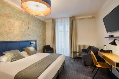 Un ou plusieurs lits dans un hébergement de l'établissement Best Western Hotel Graslin