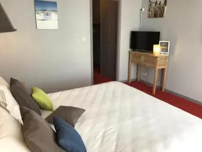 Un ou plusieurs lits dans un hébergement de l'établissement Hôtel des Dunes Noirmoutier