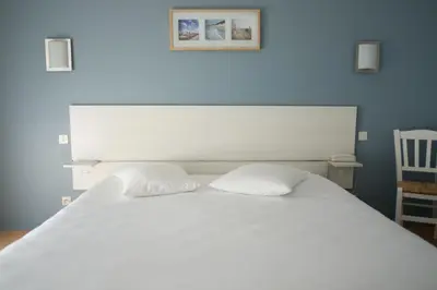 Un ou plusieurs lits dans un hébergement de l'établissement Hôtel des Dunes Noirmoutier