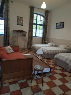 Un ou plusieurs lits dans un hébergement de l'établissement Le DOMAINE DES ECOLIERS B&B