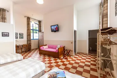 Un ou plusieurs lits dans un hébergement de l'établissement Le DOMAINE DES ECOLIERS B&B