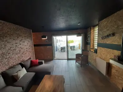 Coin salon dans l'établissement gite des mariés à 7mn du puy du F0U
