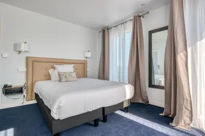 Un ou plusieurs lits dans un hébergement de l'établissement Hotel Le Berry Saint-Nazaire
