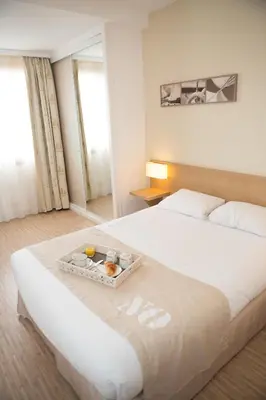 Un ou plusieurs lits dans un hébergement de l'établissement Hotel Autre Mer