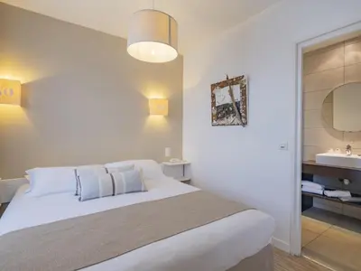Un ou plusieurs lits dans un hébergement de l'établissement Hotel Autre Mer