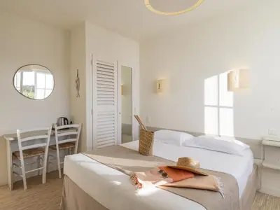 Un ou plusieurs lits dans un hébergement de l'établissement Hotel Autre Mer