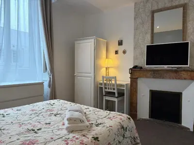 Un ou plusieurs lits dans un hébergement de l'établissement Hotel Saint Yves