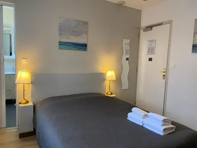 Un ou plusieurs lits dans un hébergement de l'établissement Hotel Saint Yves