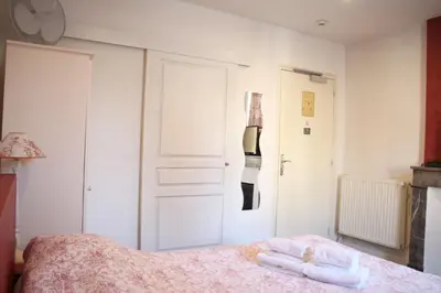 Un ou plusieurs lits dans un hébergement de l'établissement Hotel Saint Yves