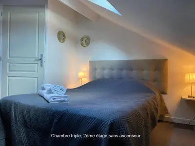 Un ou plusieurs lits dans un hébergement de l'établissement Hotel Saint Yves