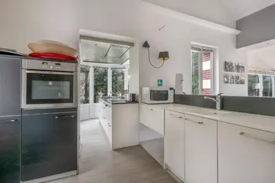 Cuisine ou kitchenette dans l'établissement Villa balnéaire pour 8 - 75m de la plage