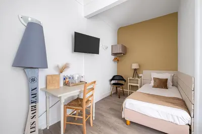 Un ou plusieurs lits dans un hébergement de l'établissement Hotel Saint Paul