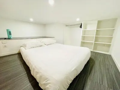 Un ou plusieurs lits dans un hébergement de l'établissement Lodge Nicolas, Hyper Centre