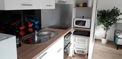 Cuisine ou kitchenette dans l'établissement L'Escale au Coteau