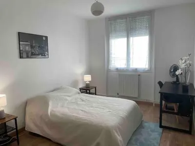 Un ou plusieurs lits dans un hébergement de l'établissement Appartement Spacieux Centre Gare Visitation