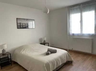Un ou plusieurs lits dans un hébergement de l'établissement Appartement Spacieux Centre Gare Visitation