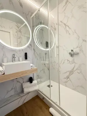 Salle de bains dans l'établissement Hôtel Beau Soleil