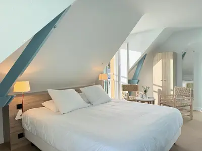 Un ou plusieurs lits dans un hébergement de l'établissement Hôtel Beau Soleil