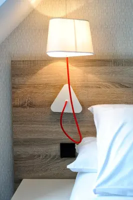 Un ou plusieurs lits dans un hébergement de l'établissement Hôtel Beau Soleil