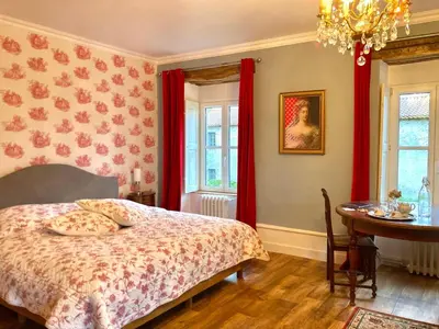 Un ou plusieurs lits dans un hébergement de l'établissement Chateau de la Preuille Gites