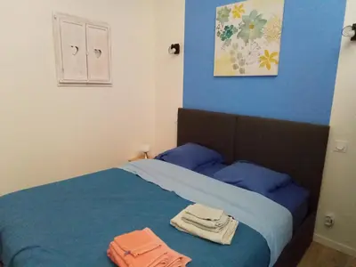 Un ou plusieurs lits dans un hébergement de l'établissement Gîte la petite maison