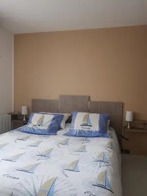 Un ou plusieurs lits dans un hébergement de l'établissement Appartement Face a la Mer