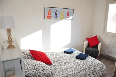 Un ou plusieurs lits dans un hébergement de l'établissement Appartement cosy refait à neuf au coeur de Saint Nazaire à 300m du front de mer