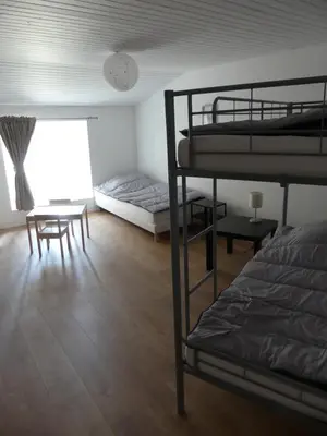 Un ou plusieurs lits dans un hébergement de l'établissement Grand gite du Puy Lambert