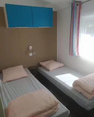 Un ou plusieurs lits dans un hébergement de l'établissement Mobile Homes by KelAir at Camping Les Genets