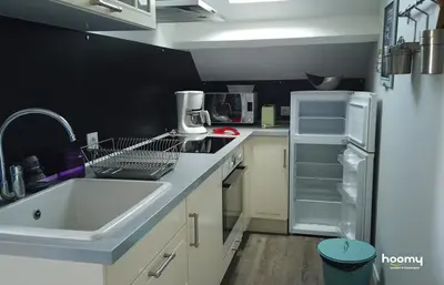 Cuisine ou kitchenette dans l'établissement Appartement cosy à quelques mètres de la plage