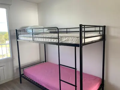 Un ou plusieurs lits dans un hébergement de l'établissement Appartement moderne 2 chambres, vue mer, rénové, 5 pers. - FR-1-323-230