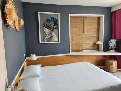 Un ou plusieurs lits dans un hébergement de l'établissement Hotel Cap D'Ambre