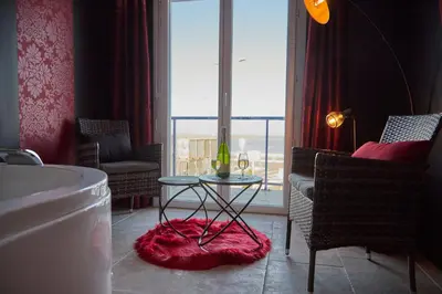 Coin salon dans l'établissement Hôtel L'Embarcadère