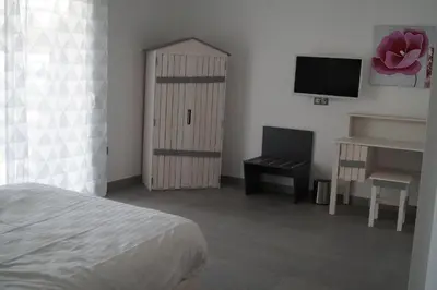 Un ou plusieurs lits dans un hébergement de l'établissement Hôtel L'Embarcadère