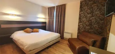 Un ou plusieurs lits dans un hébergement de l'établissement Hotel Pont De Senard