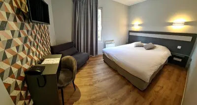 Un ou plusieurs lits dans un hébergement de l'établissement Hotel Pont De Senard