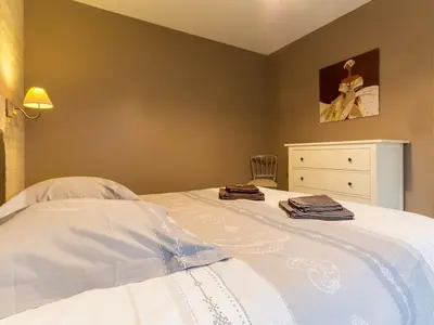Un ou plusieurs lits dans un hébergement de l'établissement Gîte tout confort avec spa et jardin clos près de Nantes - FR-1-306-849