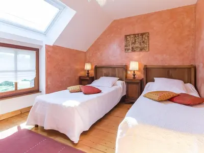 Un ou plusieurs lits dans un hébergement de l'établissement Charmante longère 3 chambres avec jardin clos, proche de Nantes, idéale pour familles et détente - FR-1-306-896