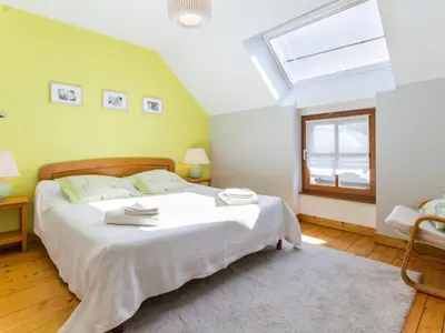Un ou plusieurs lits dans un hébergement de l'établissement Charmante longère 3 chambres avec jardin clos, proche de Nantes, idéale pour familles et détente - FR-1-306-896
