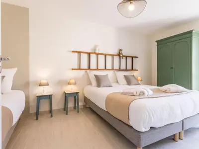 Un ou plusieurs lits dans un hébergement de l'établissement Élégant Gîte Rural avec Piscine Intérieure Chauffée près de Nantes - FR-1-306-913