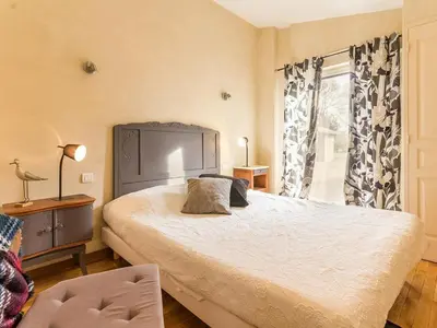 Un ou plusieurs lits dans un hébergement de l'établissement Gîte Charmant avec Jardin, Proche Plages, Wifi et Activités en Famille! - FR-1-306-1031