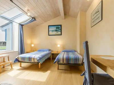 Un ou plusieurs lits dans un hébergement de l'établissement Ancien Bâtiment de Ferme Rénové entre Nantes et Pornic avec Jardin et Activités - FR-1-306-1028