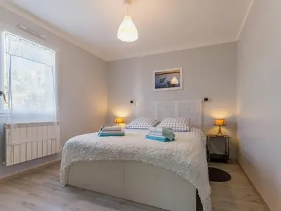 Un ou plusieurs lits dans un hébergement de l'établissement Maison de charme à Pornic avec jardin, proche des plages et commerces, clim et wifi inclus - FR-1-306-1038