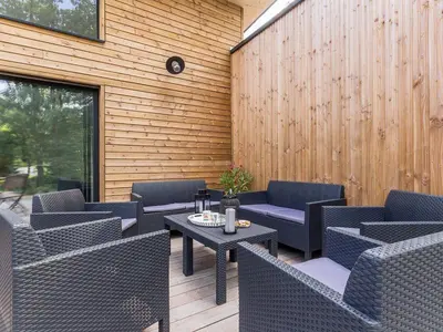 Coin salon dans l'établissement Grande maison en bois avec parc, terrasse, jeux et équipements modernes entre Nantes et Pornic - FR-1-306-1051