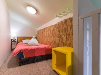 Un ou plusieurs lits dans un hébergement de l'établissement Gîte paisible avec grand jardin près du lac, ping-pong, vélo, climatisation, proche de Nantes et plages - FR-1-306-1056